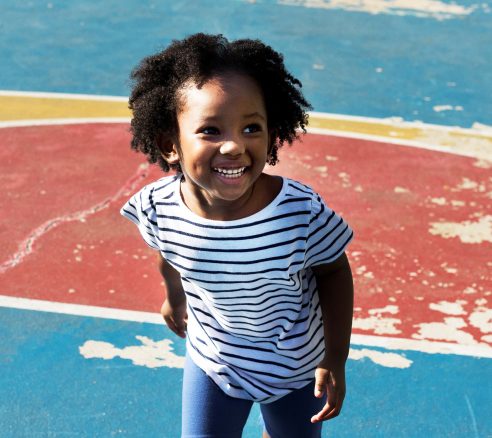 Cheerful young African kid